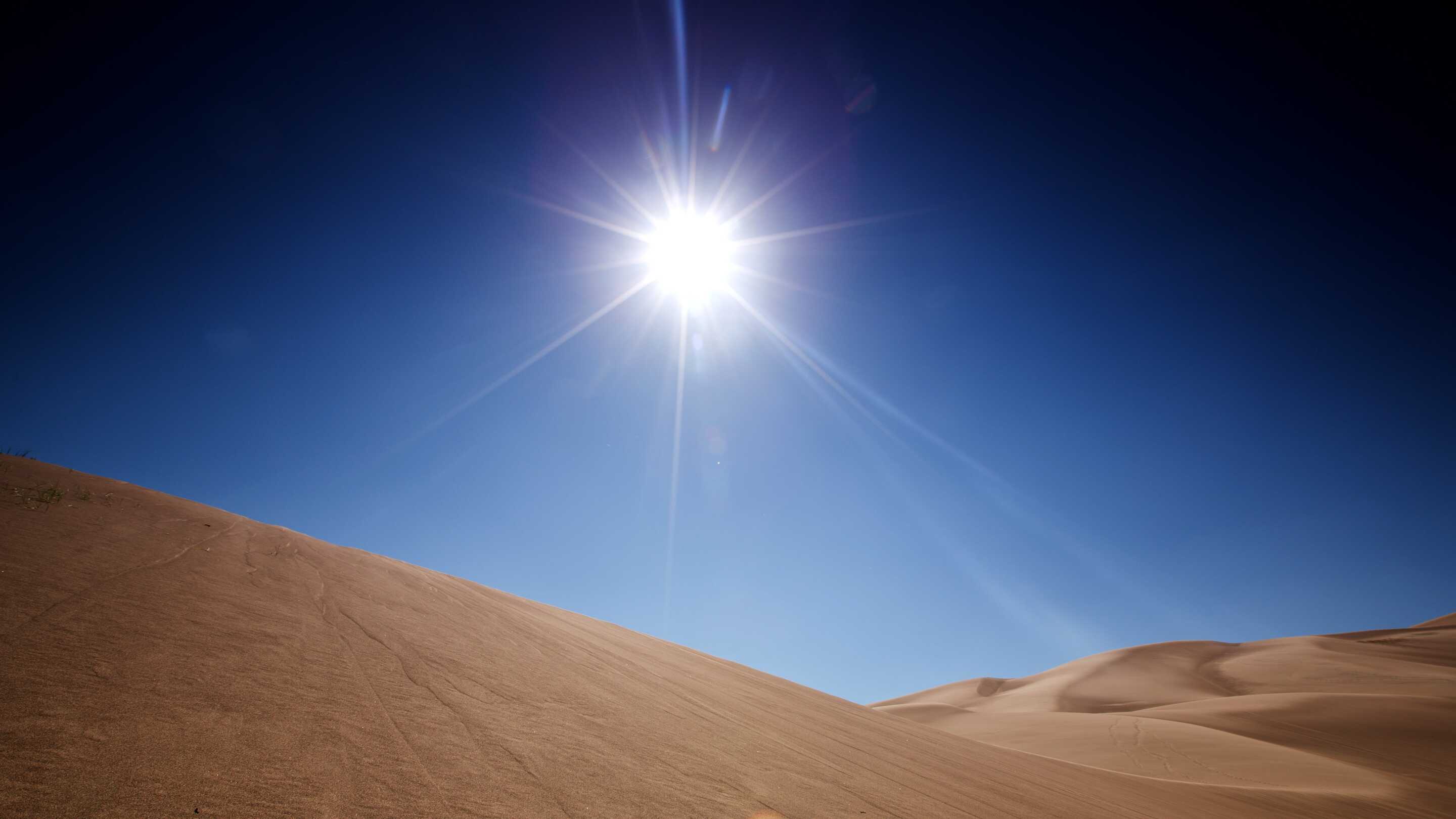 High Brightness Monitor sunlight readable a sun shining over a sandy hill